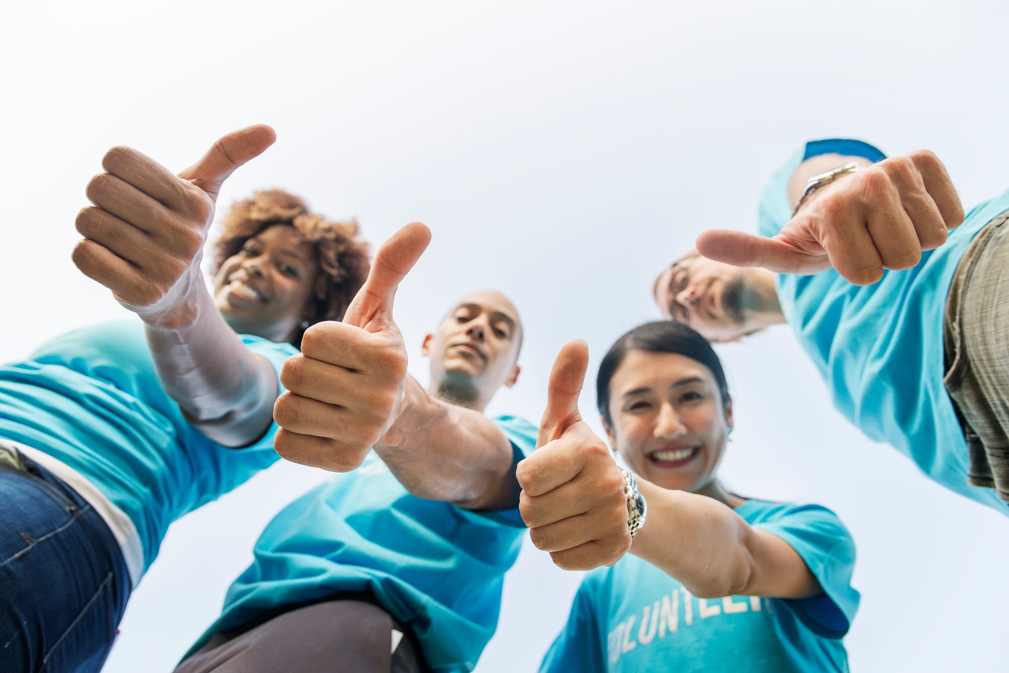 Group of happy and diverse volunteers