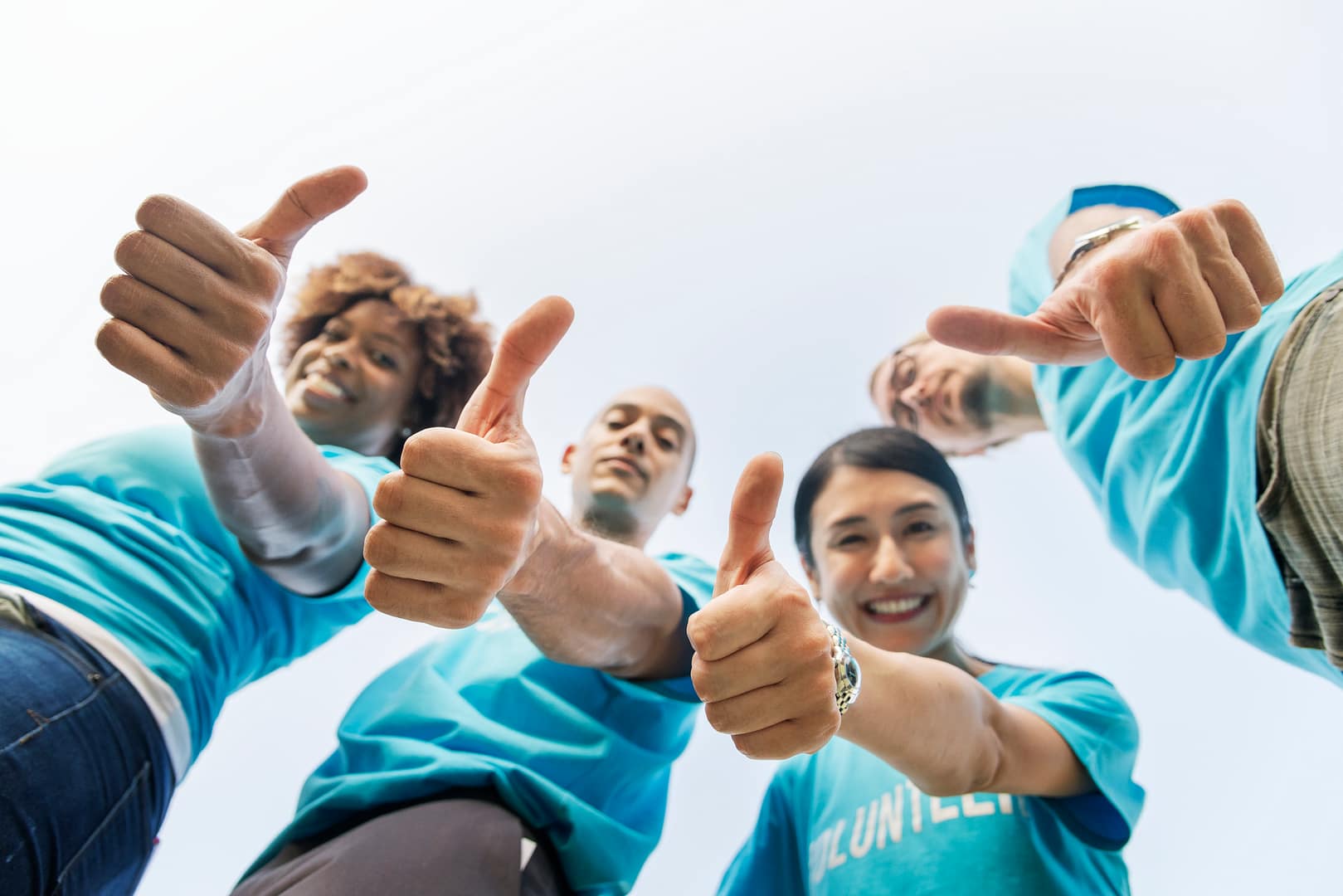 Group of happy and diverse volunteers